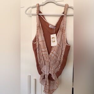 Manaola Women's Sleeveless bodysuit.